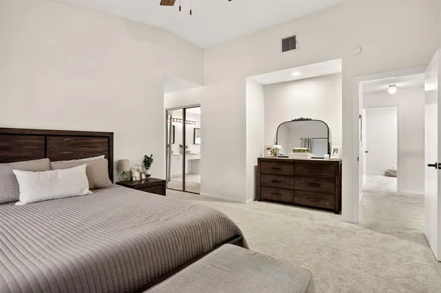 a bedroom with a bed and a dresser