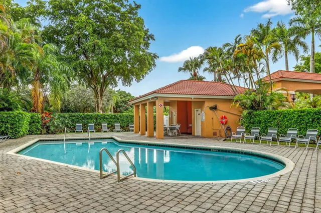 a view of a swimming pool with a patio