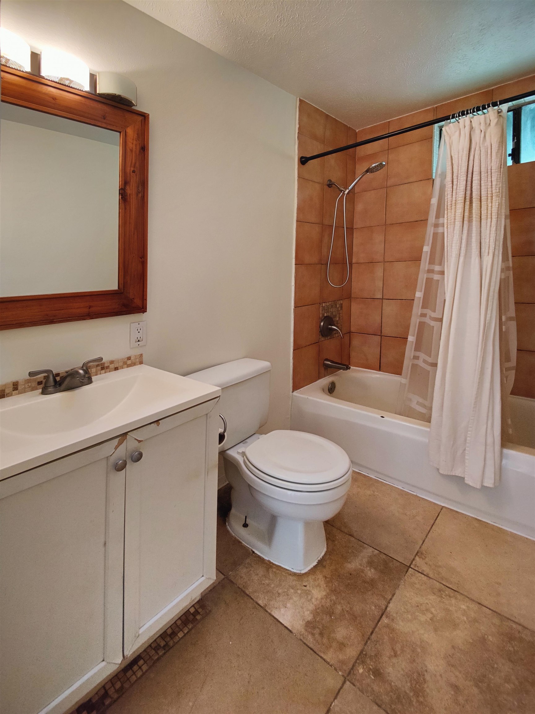 142 Peahi Road Haiku, HI 96708 - Photo 11 of 21 a bathroom with a sink a toilet and shower