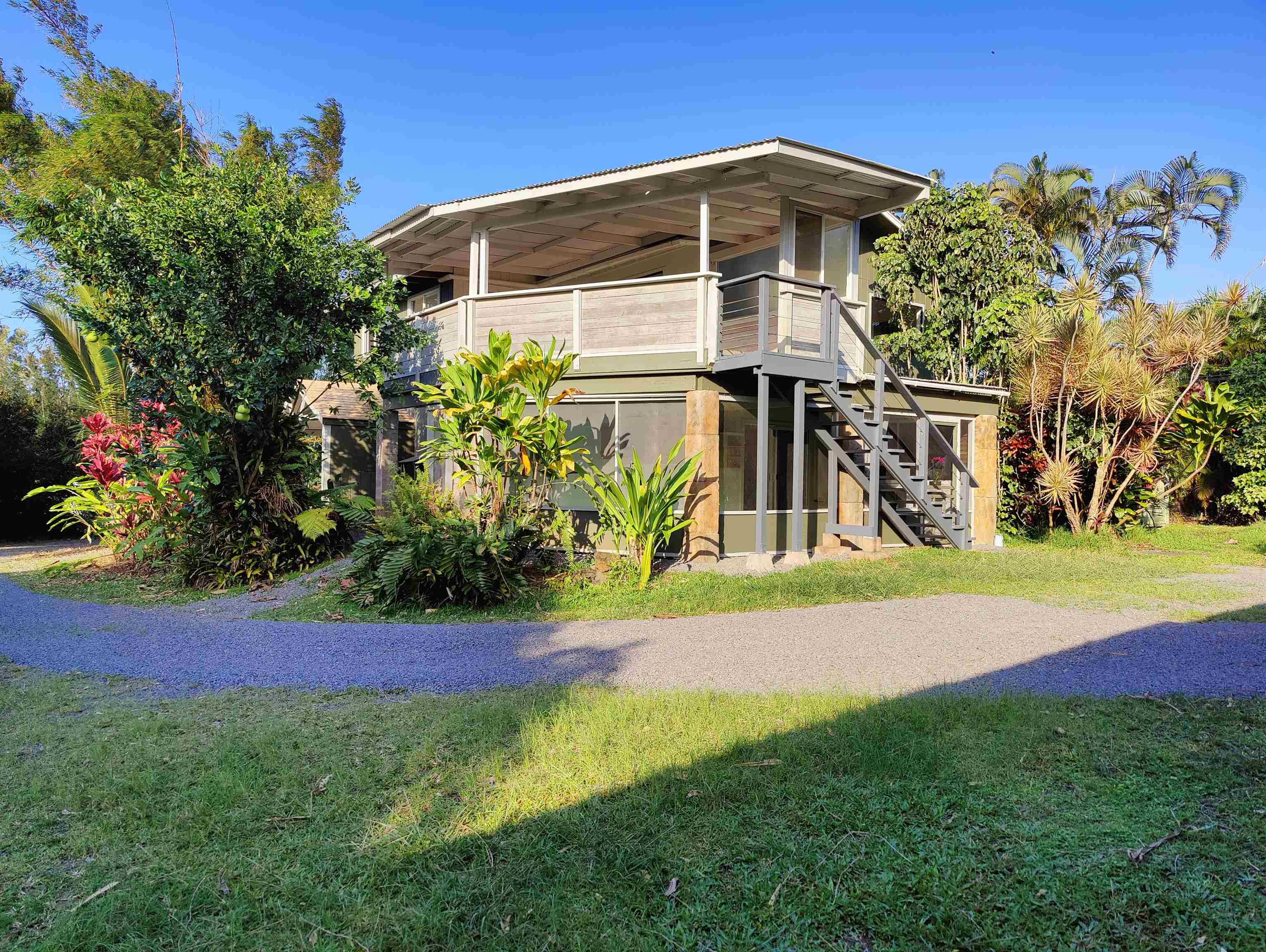 142 Peahi Road Haiku, HI 96708 - Photo 15 of 21 a front view of a house with a yard