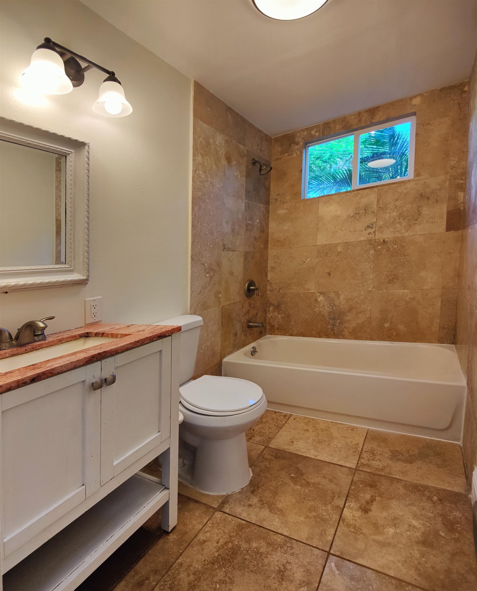 142 Peahi Road Haiku, HI 96708 - Photo 10 of 21 a bathroom with a toilet a sink and bathtub