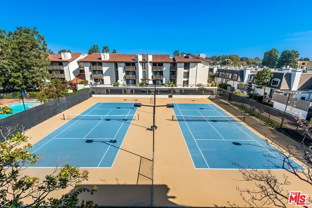 a view of a swimming pool with a lounge chairs