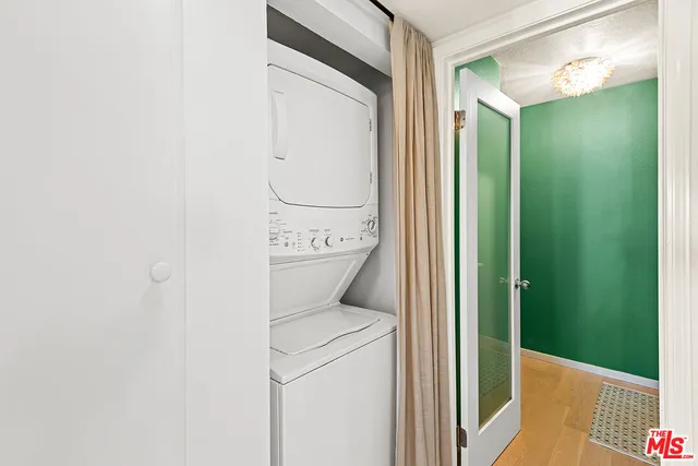 a front view of a building with a garden