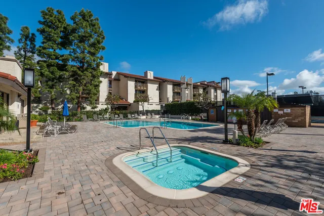 a view of a swimming pool with a lounge chairs