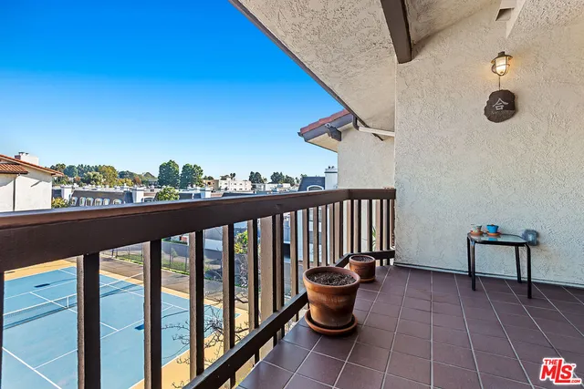 a balcony with outdoor seating