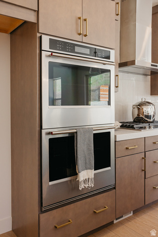5902 Canyon Rim Road, Unit 620 Lehi, UT 84048 - Photo 6 of 78 Built-in stainless steel double oven with a gas range, integrated within neutral-toned cabinetry featuring gold-finish hardware