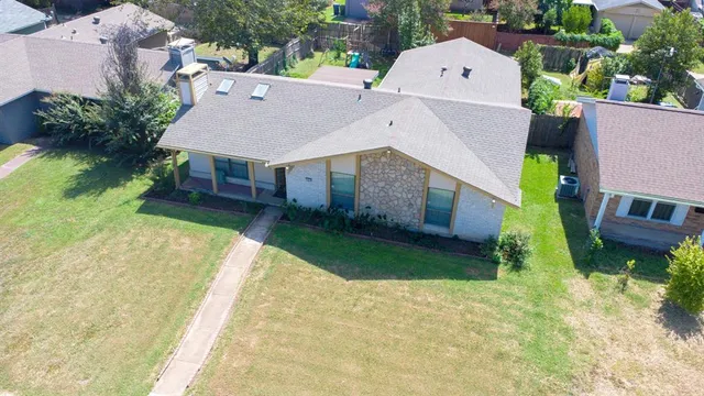 a aerial view of a house with swimming pool