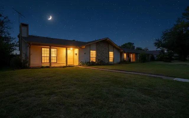 a front view of house with yard and green space