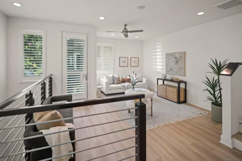 a kitchen view with wooden floor and windows