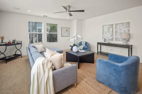 a living room with furniture and windows