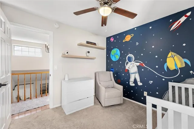 a bathroom with a toilet a sink and a mirror