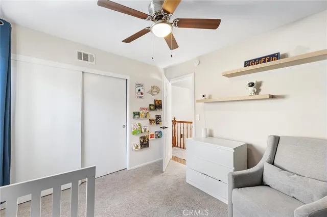 a bathroom with a sink mirror and toilet