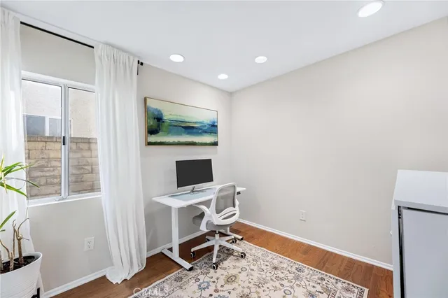 a room with a sink and a mirror