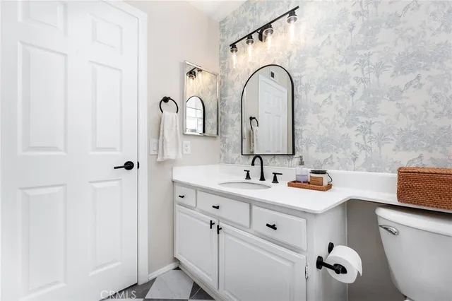 a view of entryway and hall with a chandelier