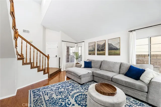 a living room with furniture and a rug