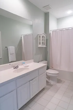a bathroom with a toilet sink and a shower