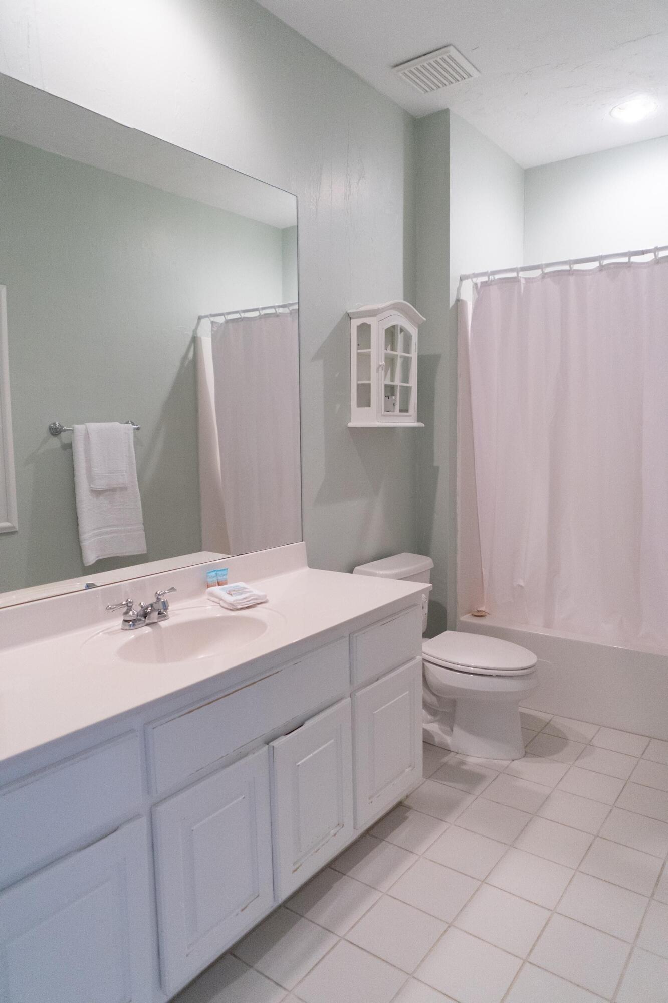 223 Paradise By The Sea Boulevard Inlet Beach, FL 32461 - Photo 23 of 35 a bathroom with a sink a toilet and a shower