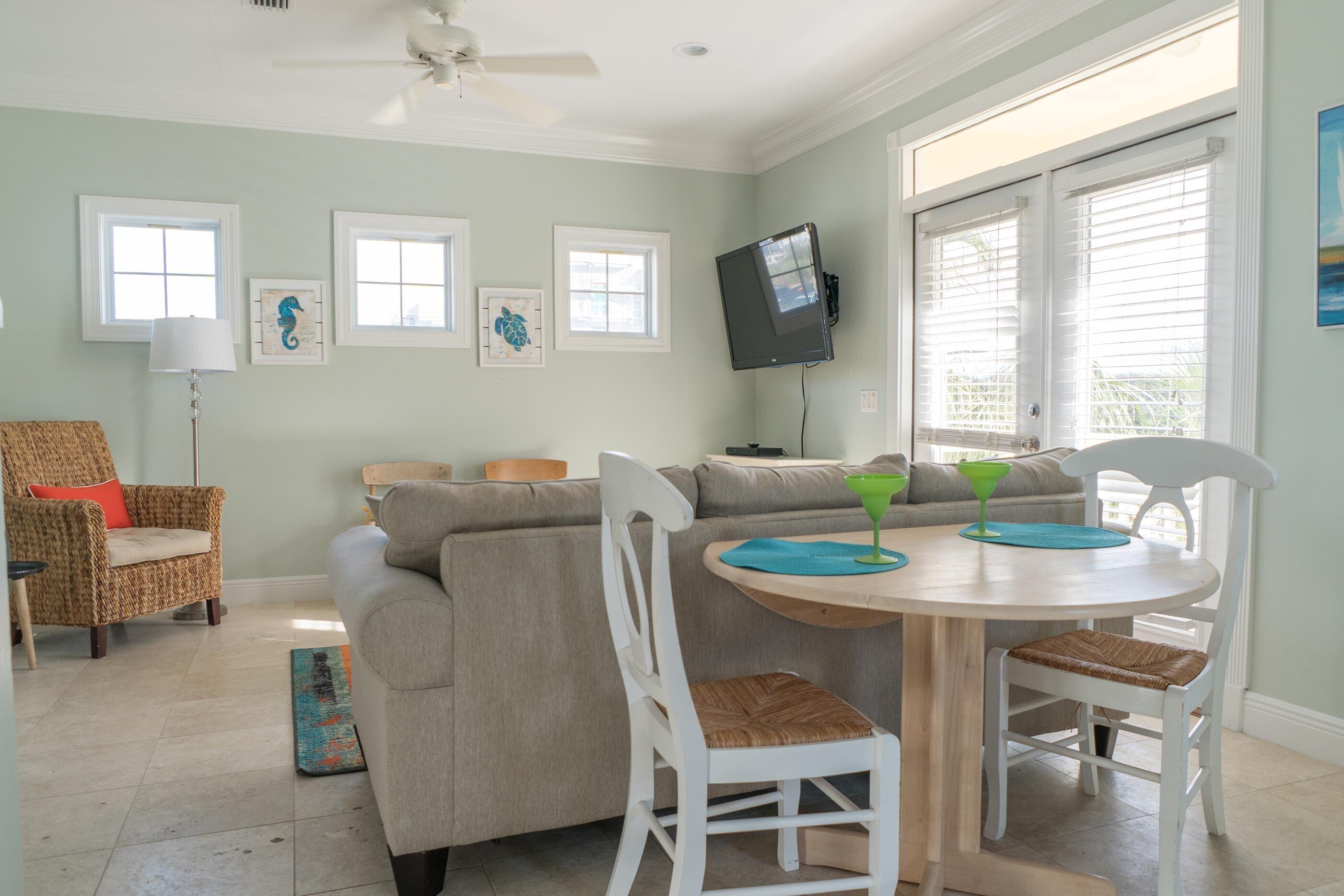 223 Paradise By The Sea Boulevard Inlet Beach, FL 32461 - Photo 27 of 35 a view of a dining room with furniture and a window