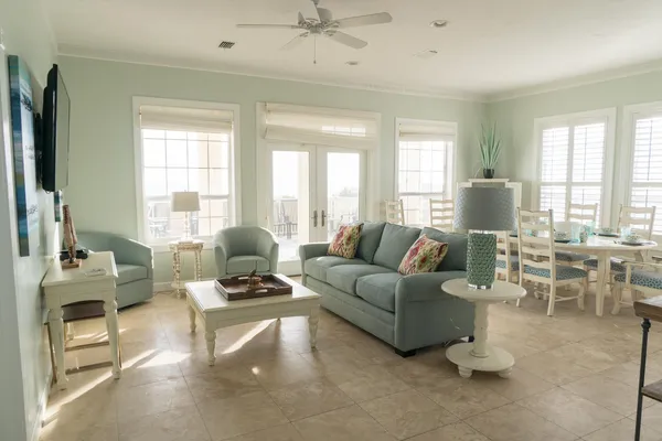 a living room with furniture and a flat screen tv