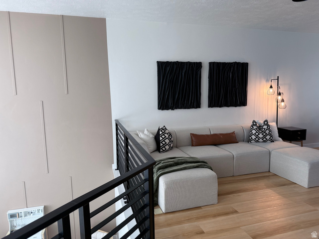 774 West 480 South American Fork, UT 84003 - Photo 33 of 76 Interior space featuring a modern black metal horizontal bar railing overlooking a living area