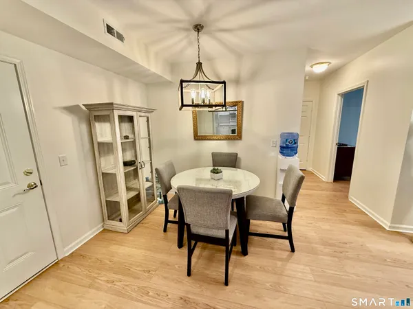 a dining room with furniture and window