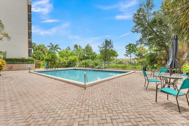 a view of a swimming pool with a lounge chairs