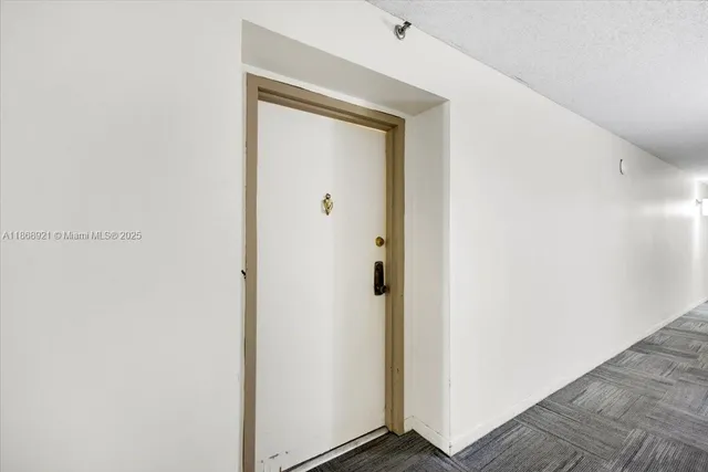 a view of a small space with wooden floor