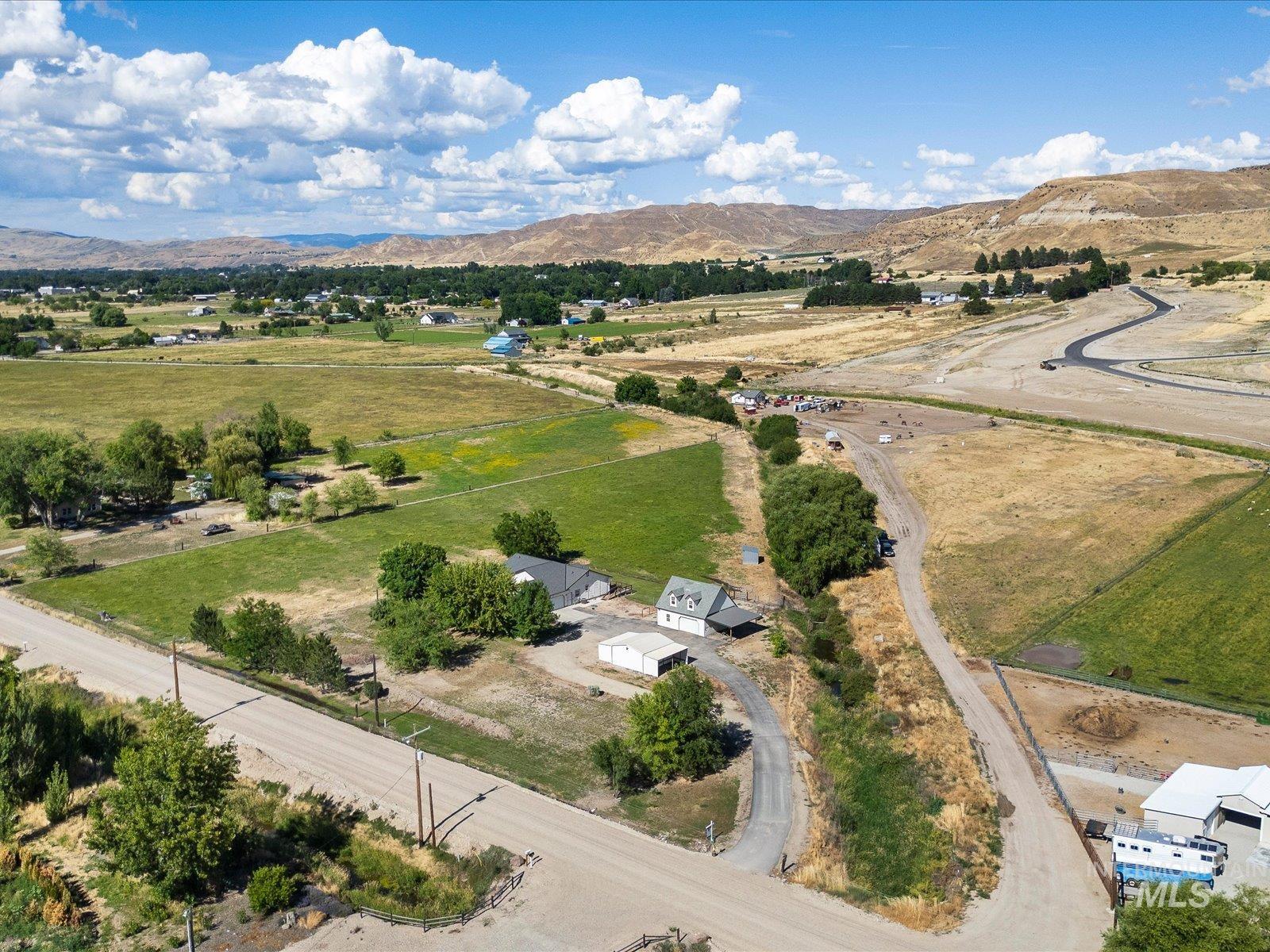 3540 Wills Road Emmett, ID 83617 - Photo 2 of 36 Expansive rural property featuring multiple residential structures, large open fields, and mature trees