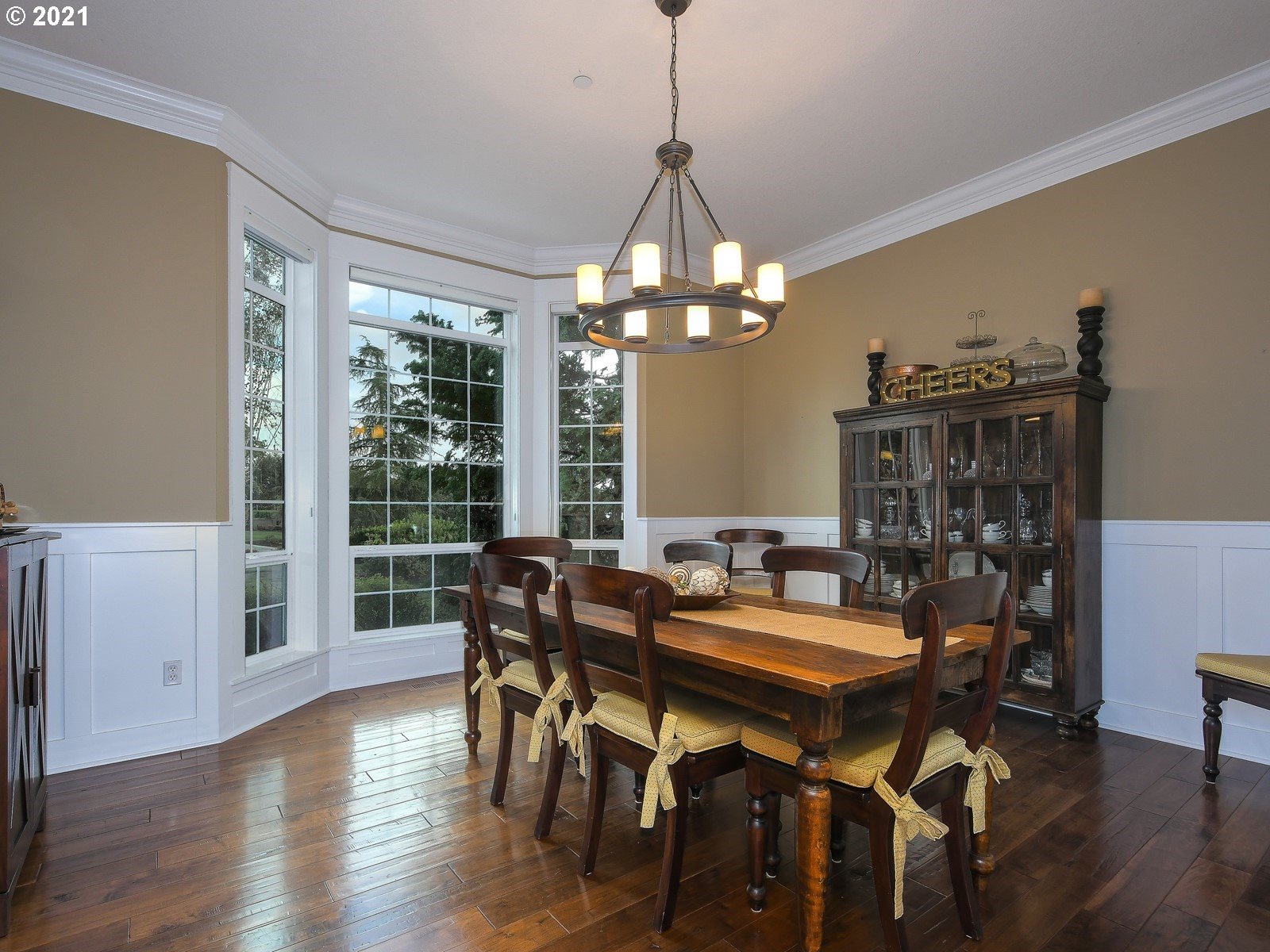 22706 Northeast 7th Court Ridgefield, WA 98642 - Photo 3 of 32 a view of a dining room with furniture window and wooden floor