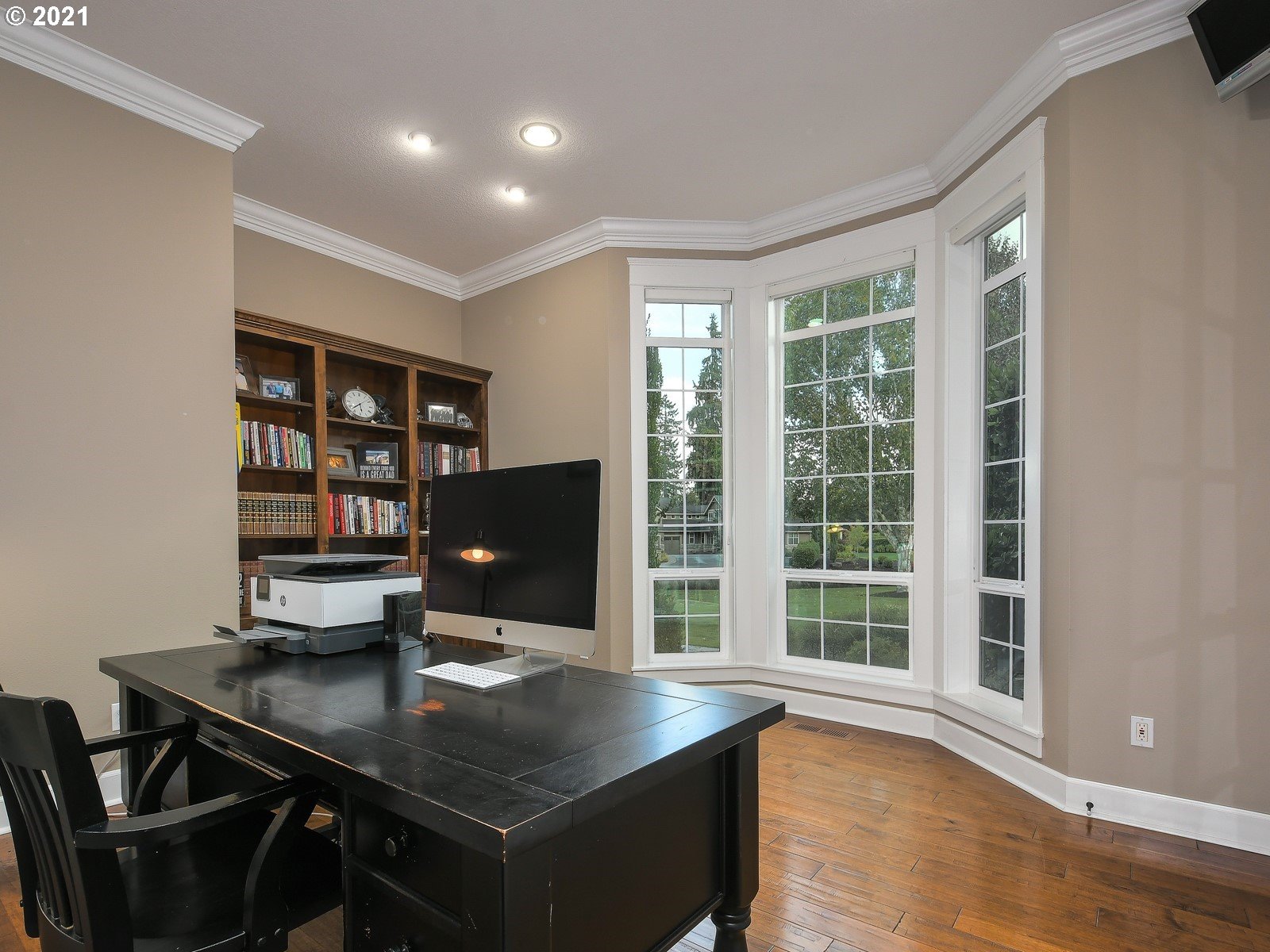 22706 Northeast 7th Court Ridgefield, WA 98642 - Photo 4 of 32 a view of a workspace with furniture and a window