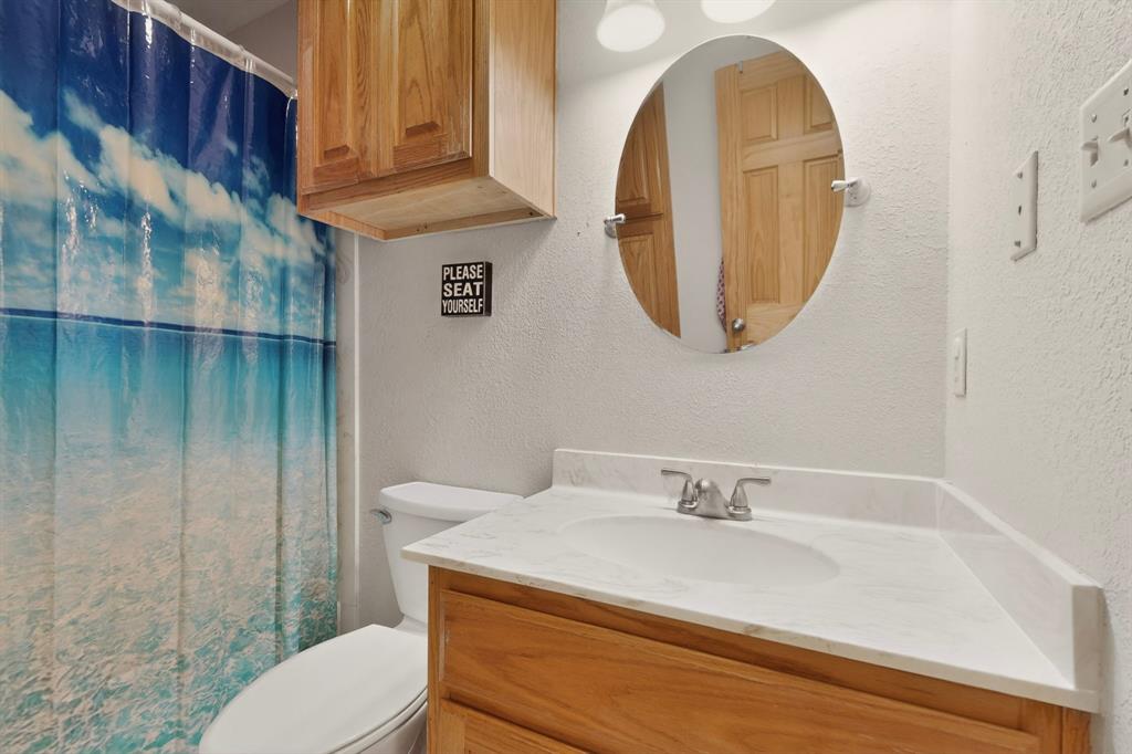 321 Redbud Street Rhome, TX 76078 - Photo 8 of 17 Generous hall bathroom