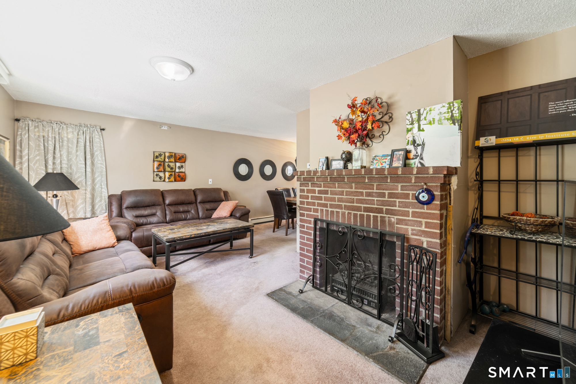 146 Highland Drive Waterbury, CT 06708 - Photo 3 of 31 a living room with furniture a rug and a fireplace