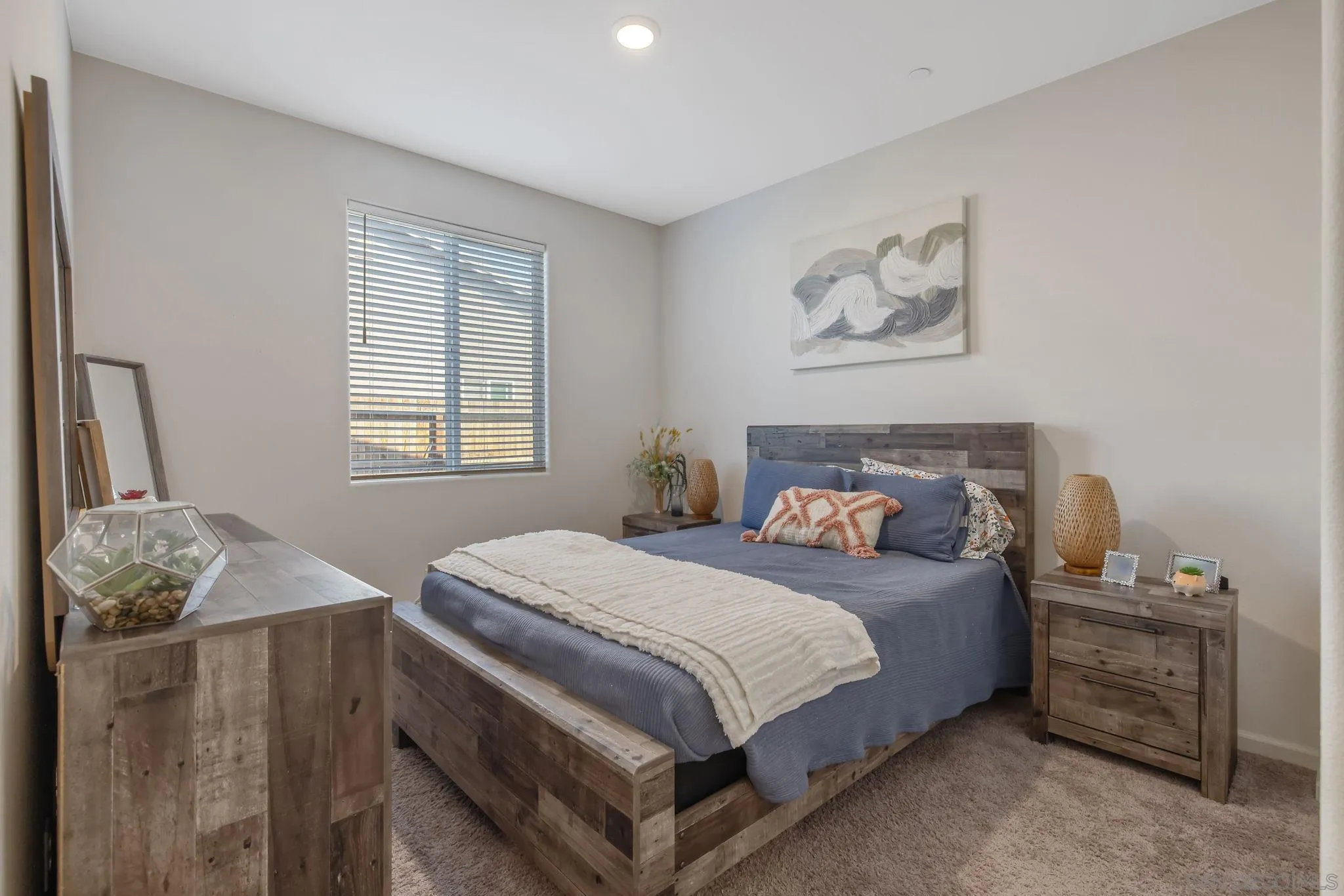 495 Pearl Drive Lemoore, CA 93245 - Photo 11 of 45 a bedroom with a bed and a window