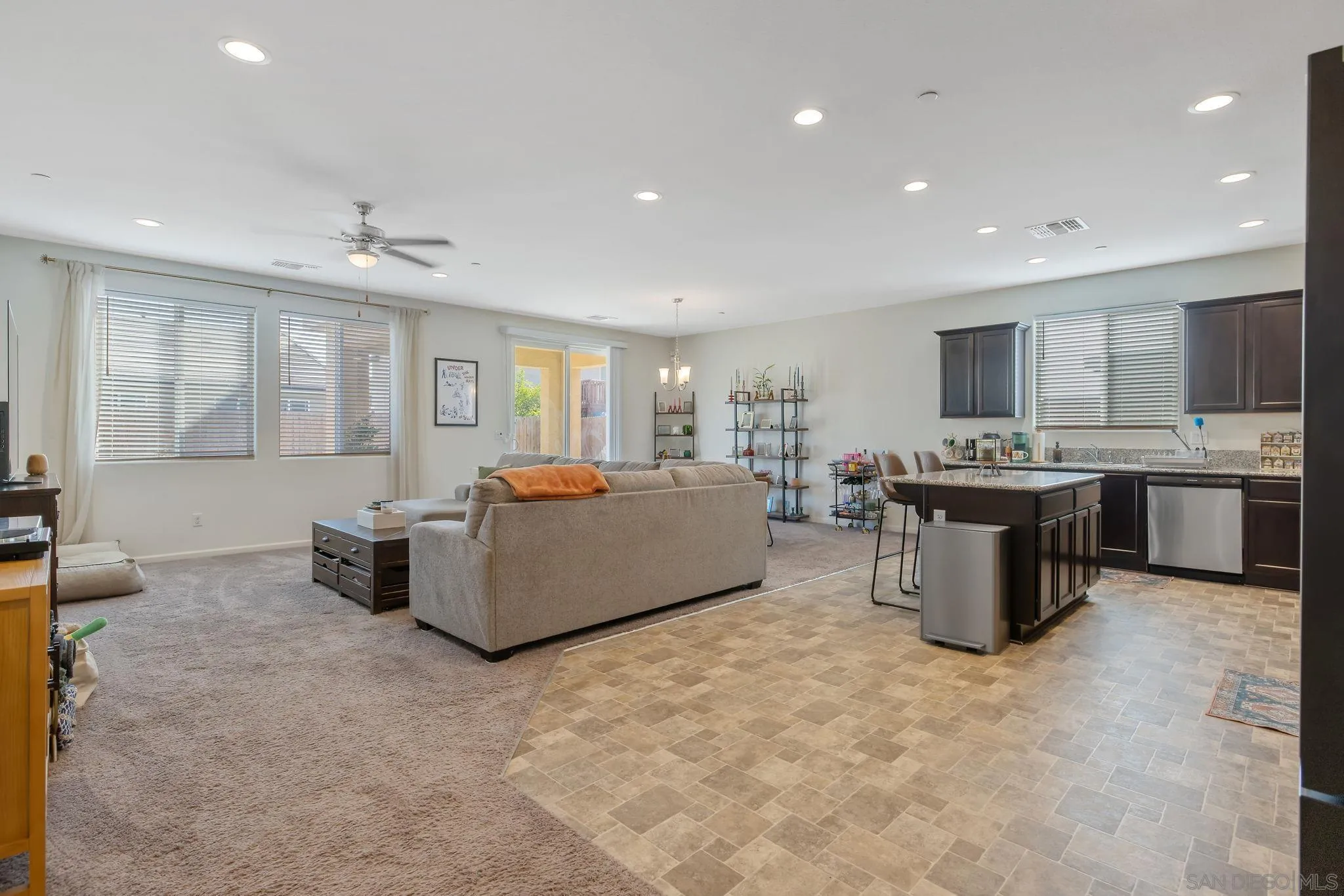 495 Pearl Drive Lemoore, CA 93245 - Photo 16 of 45 a living room with furniture and a flat screen tv