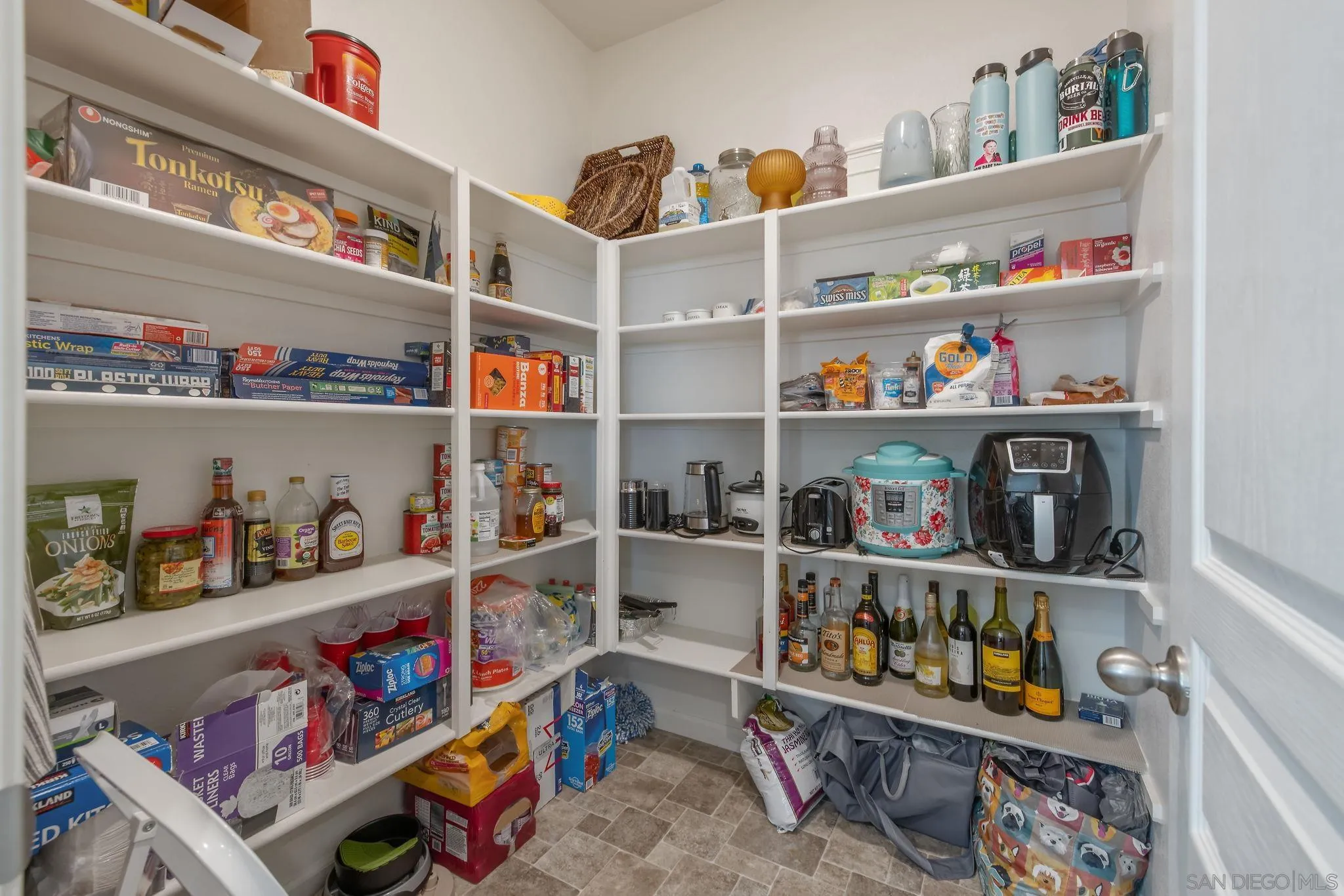 495 Pearl Drive Lemoore, CA 93245 - Photo 21 of 45 a room with storage and a shelf