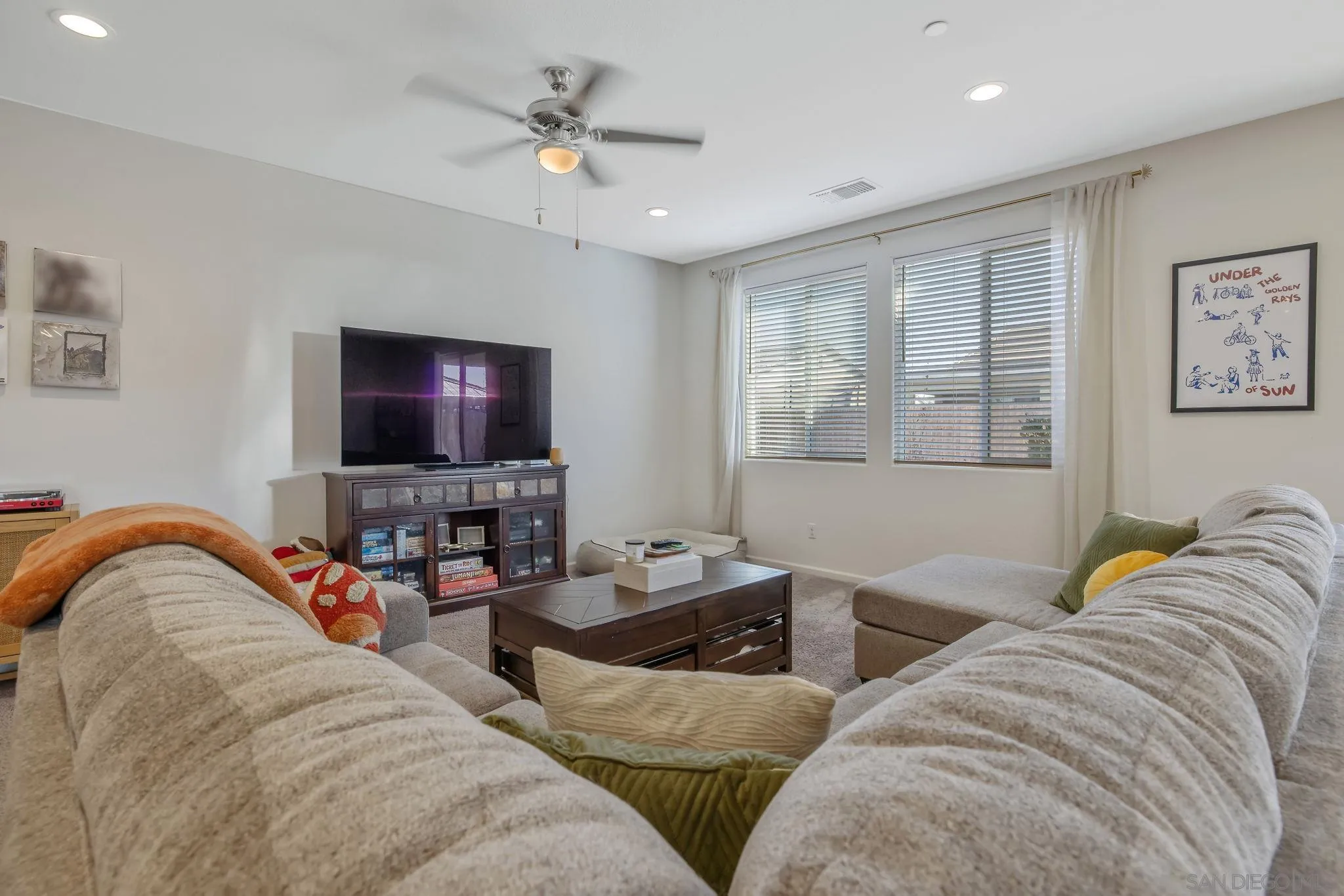 495 Pearl Drive Lemoore, CA 93245 - Photo 23 of 45 a living room with furniture and a flat screen tv