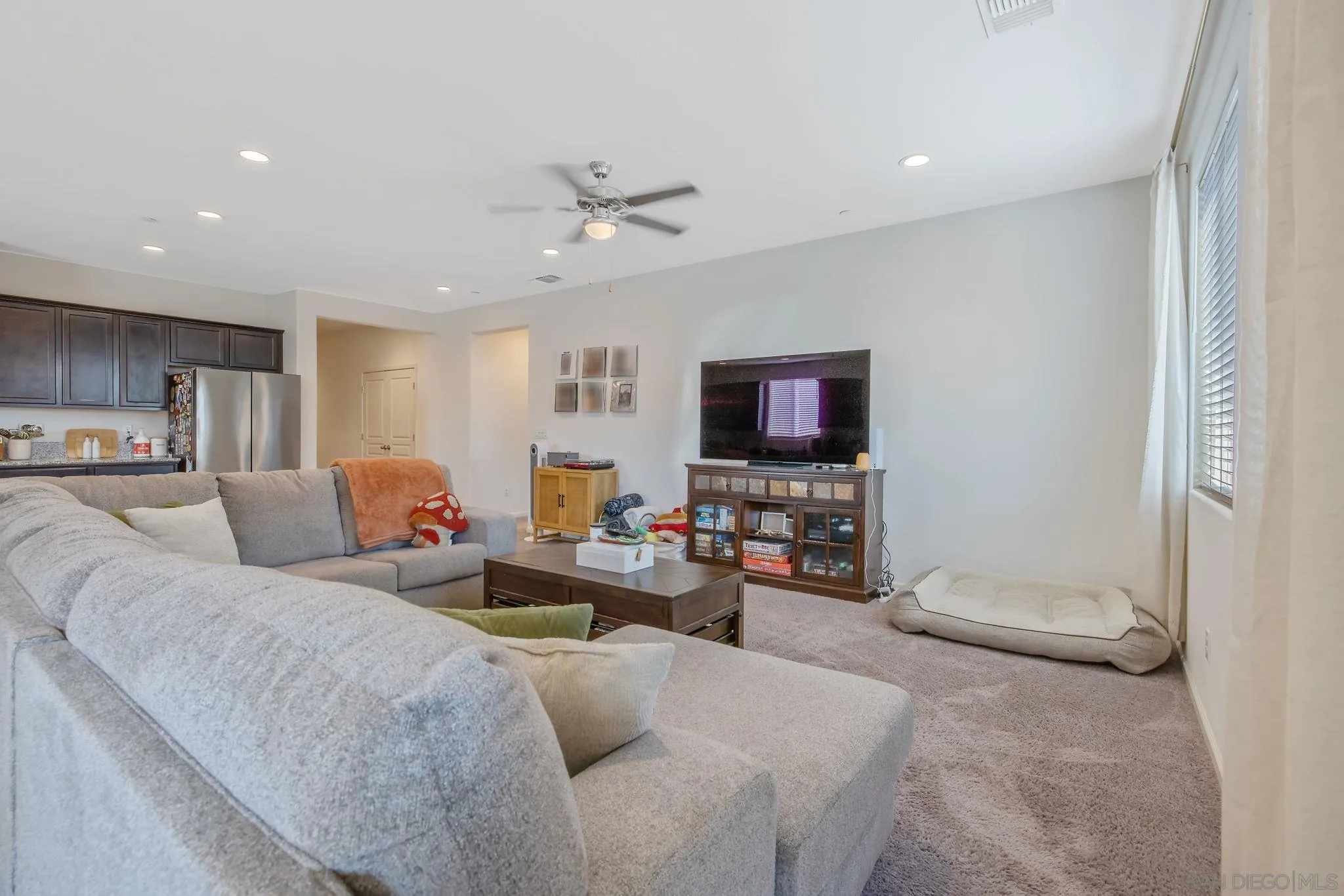 495 Pearl Drive Lemoore, CA 93245 - Photo 24 of 45 a living room with furniture and a flat screen tv