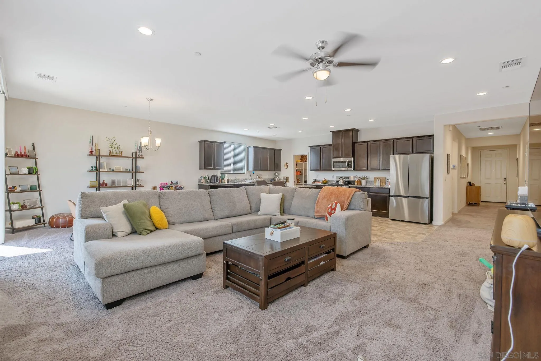 495 Pearl Drive Lemoore, CA 93245 - Photo 25 of 45 a living room with furniture and kitchen view