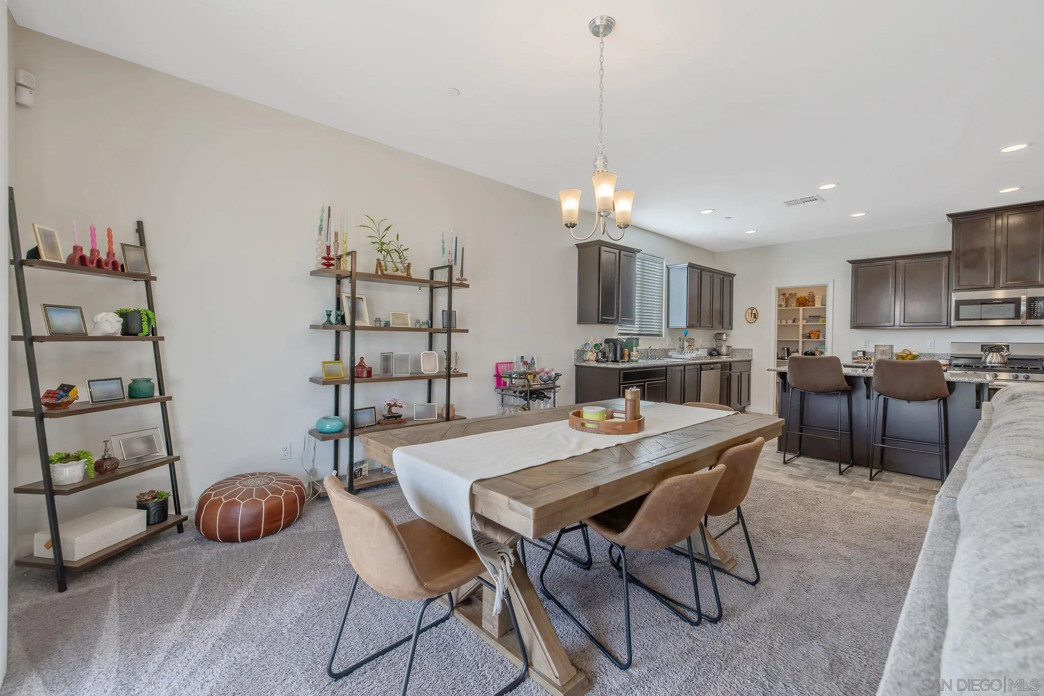 495 Pearl Drive Lemoore, CA 93245 - Photo 26 of 45 a view of a dining room with furniture and wooden floor