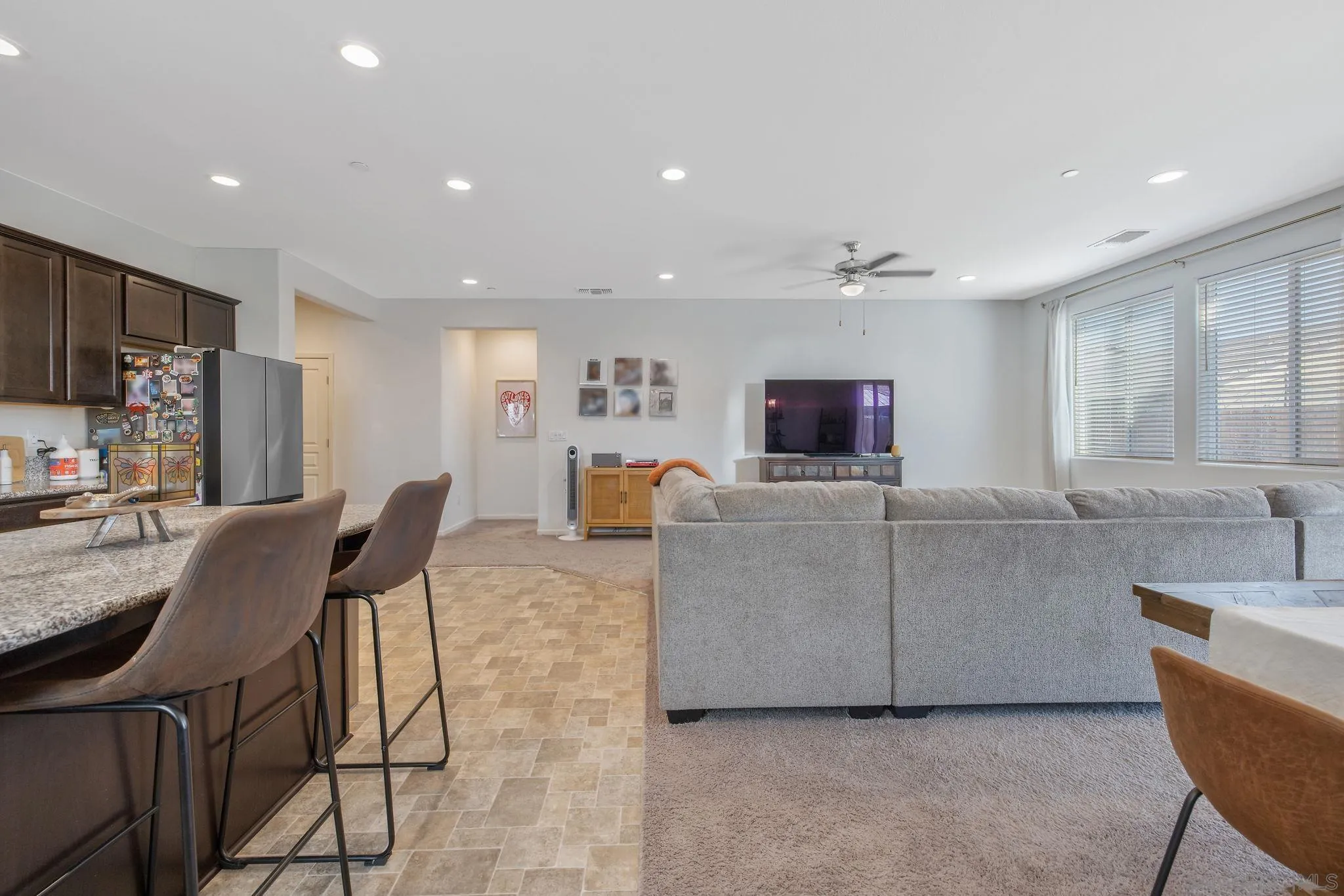 495 Pearl Drive Lemoore, CA 93245 - Photo 29 of 45 a living room with furniture and a flat screen tv
