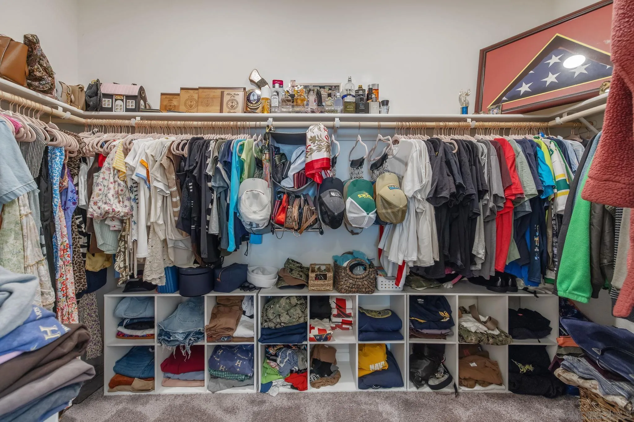 495 Pearl Drive Lemoore, CA 93245 - Photo 37 of 45 a view of walk in closet with clothes and shoes