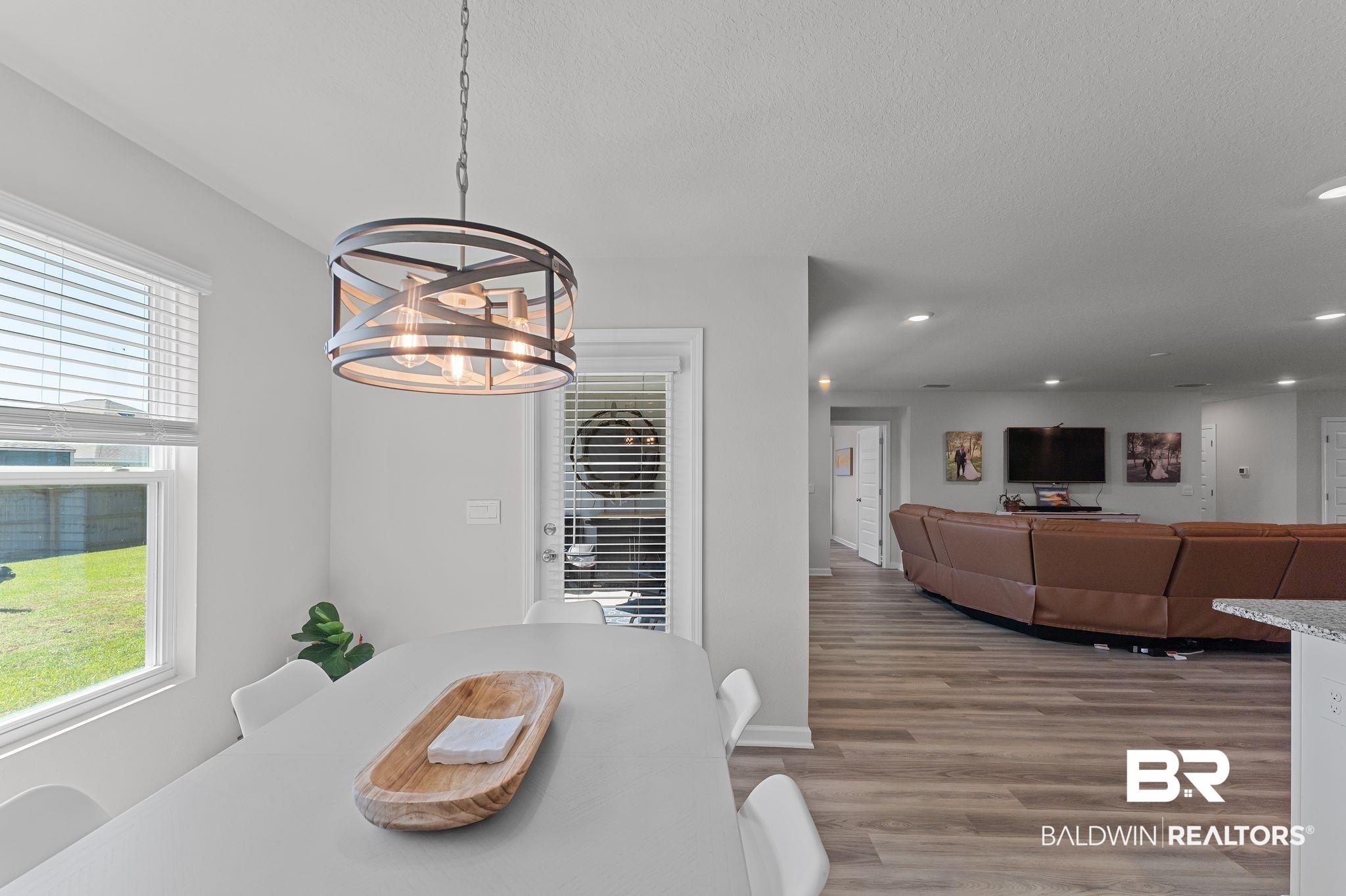 24337 Ringneck Loop Elberta, AL 36530 - Photo 10 of 34 Dining room with light wood finished floors, recessed lighting, a chandelier, and a textured ceiling