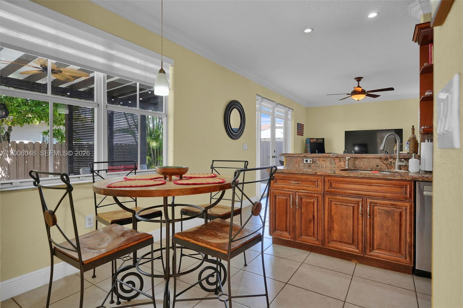 6114 Southwest 158th Pass Miami, FL 33193 - Photo 13 of 37 a dinning area with a table and chairs