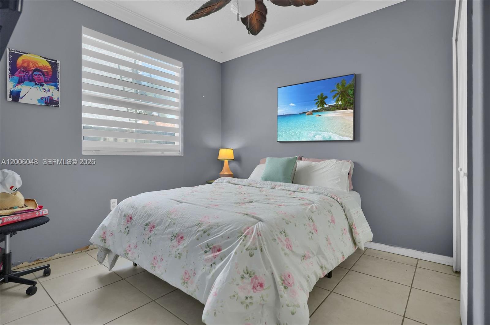 6114 Southwest 158th Pass Miami, FL 33193 - Photo 15 of 37 a bedroom with a bed and a window