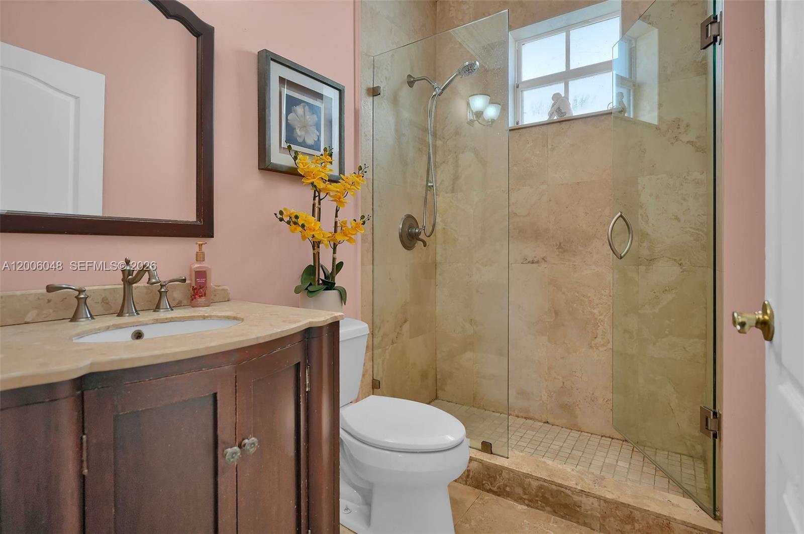 6114 Southwest 158th Pass Miami, FL 33193 - Photo 16 of 37 a bathroom with a sink toilet and shower