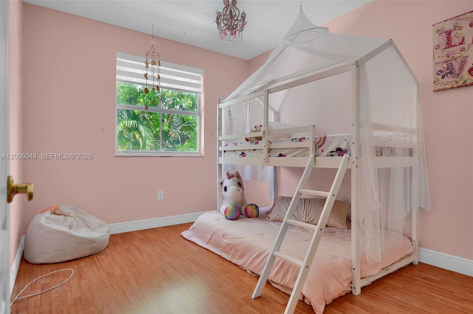 6114 Southwest 158th Pass Miami, FL 33193 - Photo 18 of 37 a room with gym equipment and wooden floor