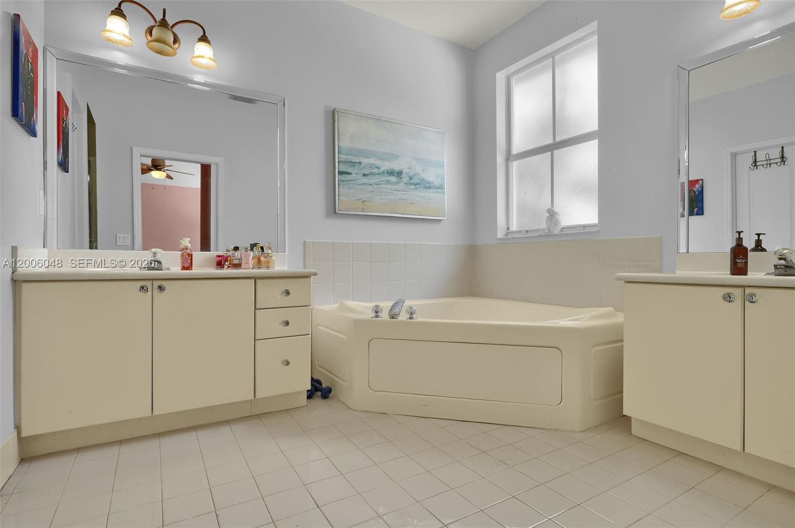 6114 Southwest 158th Pass Miami, FL 33193 - Photo 25 of 37 a bathroom with a sink a vanity and a mirror