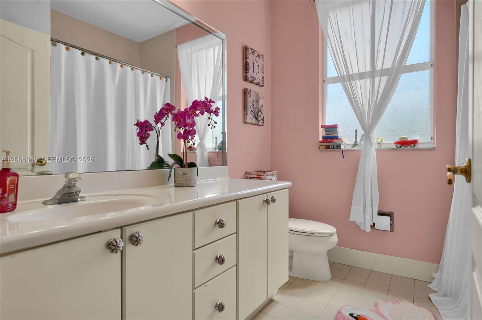 6114 Southwest 158th Pass Miami, FL 33193 - Photo 27 of 37 a bathroom with a granite countertop sink a toilet and a mirror
