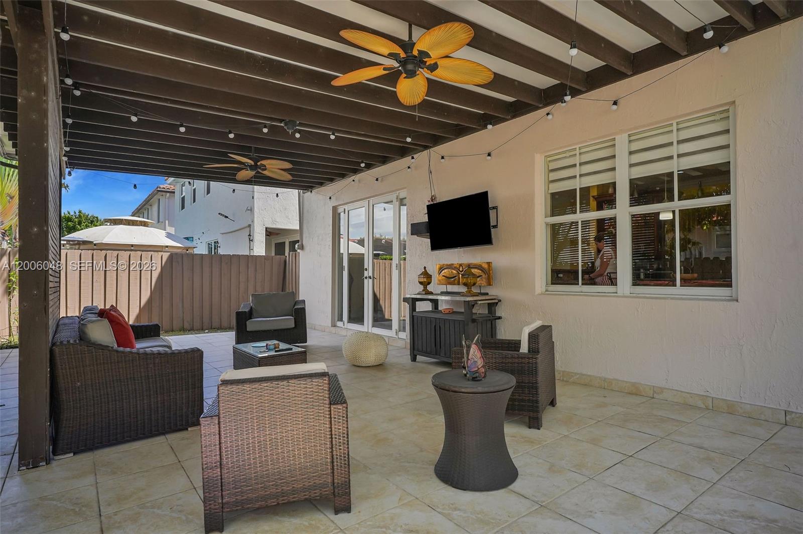 6114 Southwest 158th Pass Miami, FL 33193 - Photo 30 of 37 a work room with furniture a flat screen tv and kitchen view
