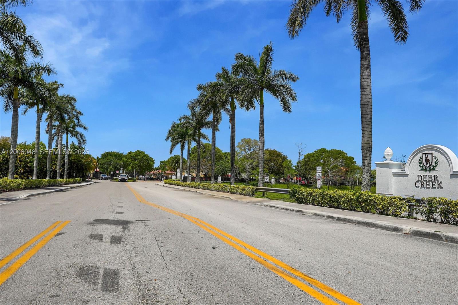 6114 Southwest 158th Pass Miami, FL 33193 - Photo 37 of 37 an ocean view with beach and palm trees